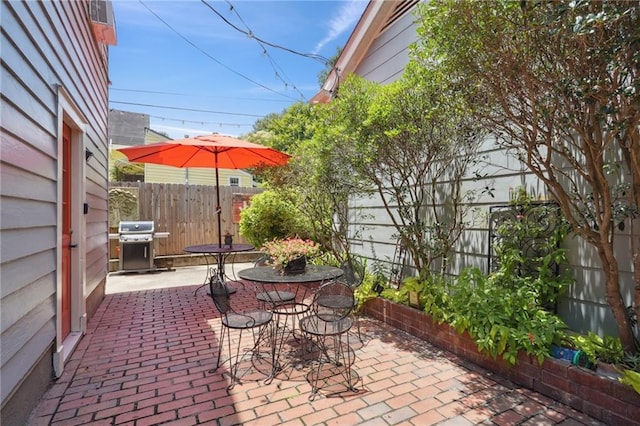 223840 Dante St, New Orleans, LA 70118 - view of patio with a grill and outdoor dining space