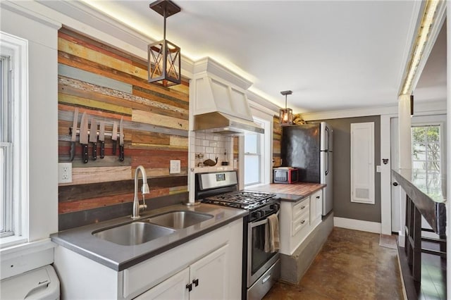 223840 Dante St, New Orleans, LA 70118 - kitchen with stainless steel appliances, white cabinets, and decorative light fixtures