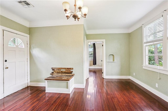 223840 Dante St, New Orleans, LA 70118 - entryway featuring plenty of natural light, dark wood-style flooring, a chandelier, and ornamental molding