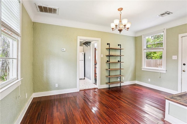 223840 Dante St, New Orleans, LA 70118 - empty room featuring wood-type flooring, a textured wall, a chandelier, and crown molding