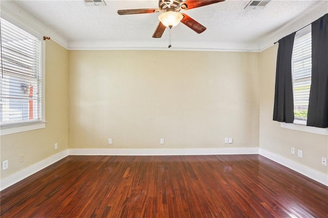 223840 Dante St, New Orleans, LA 70118 - spare room with dark wood-style flooring, a textured ceiling, ceiling fan, and plenty of natural light