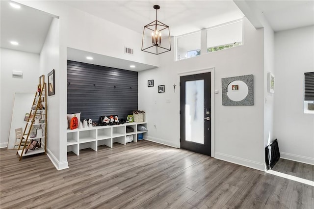6709 Hastings St, Metairie, LA 70003 - foyer entrance with wood finished floors, a towering ceiling, a chandelier, and recessed lighting