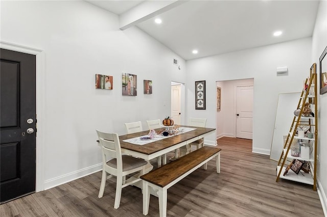 6709 Hastings St, Metairie, LA 70003 - dining space featuring beam ceiling, high vaulted ceiling, wood finished floors, and recessed lighting