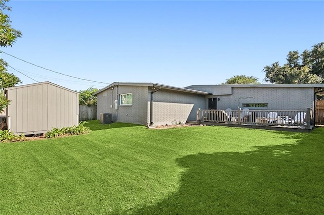6709 Hastings St, Metairie, LA 70003 - back of property with a storage shed, a deck, and brick siding