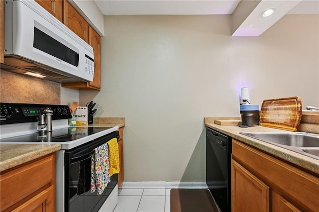 181 Sandra Del Mar Dr Unit 181, Mandeville, LA 70448 - kitchen featuring electric range oven, white microwave, and brown cabinets