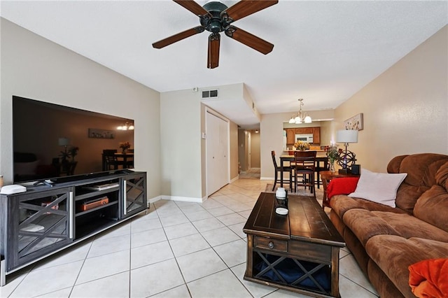 181 Sandra Del Mar Dr Unit 181, Mandeville, LA 70448 - living area featuring a ceiling fan, light tile patterned flooring, and a chandelier
