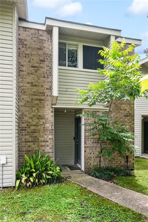 181 Sandra Del Mar Dr Unit 181, Mandeville, LA 70448 - back of house with brick siding