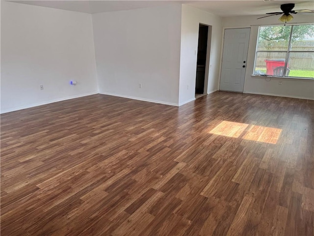 204 Portsmouth Dr, Slidell, LA 70460 - empty room with a ceiling fan and dark wood-type flooring