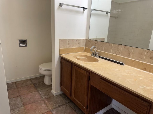 204 Portsmouth Dr, Slidell, LA 70460 - bathroom featuring vanity, stone finish floors, and backsplash
