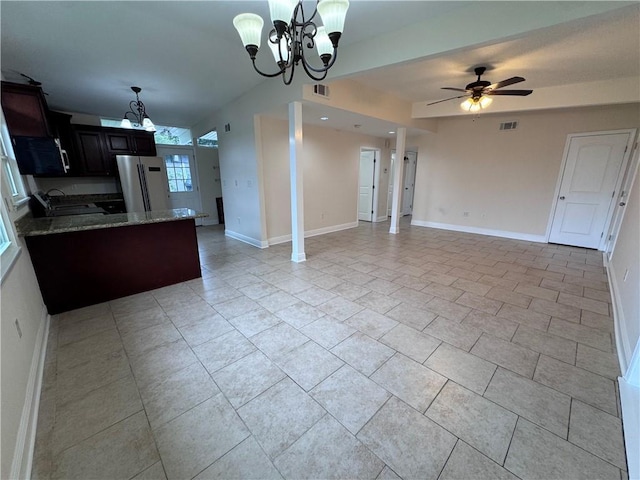 6 Brentwood Dr, Metairie, LA 70003 - kitchen with freestanding refrigerator, a chandelier, and open floor plan