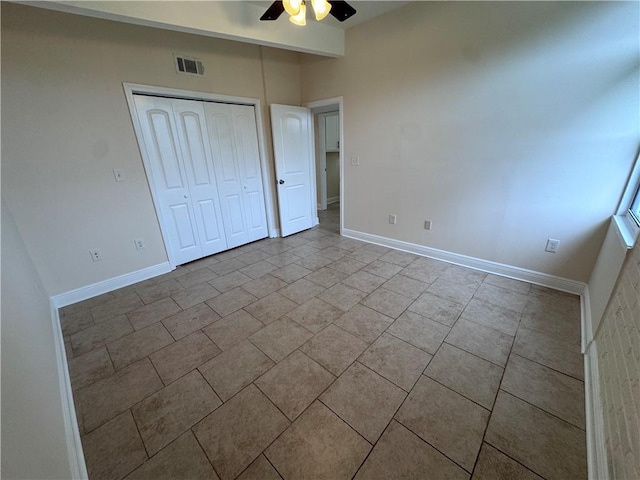 6 Brentwood Dr, Metairie, LA 70003 - unfurnished bedroom featuring tile patterned flooring, a closet, and a ceiling fan