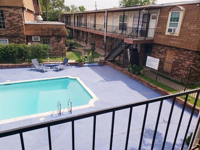 6200 Riverside Dr Unit 625, Metairie, LA 70003 - community pool featuring a patio and stairway