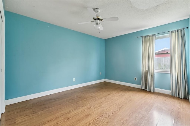 761 Holyoke Pl, Terrytown, LA 70056 - unfurnished room with wood finished floors, a ceiling fan, and a textured ceiling