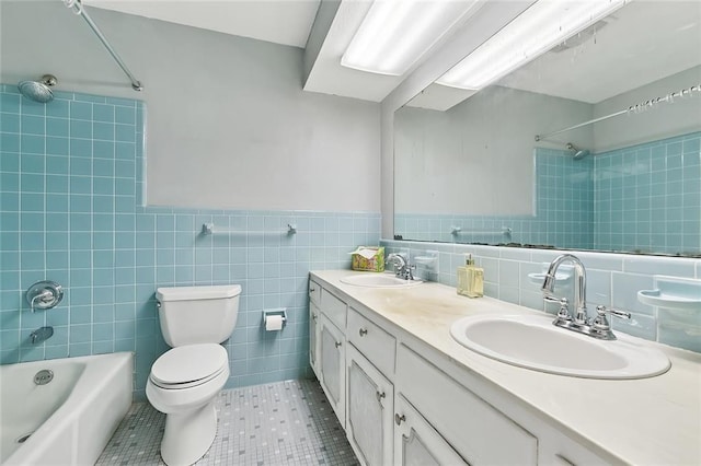 761 Holyoke Pl, Terrytown, LA 70056 - full bath with tile walls, shower / bathtub combination, double vanity, and tile patterned floors