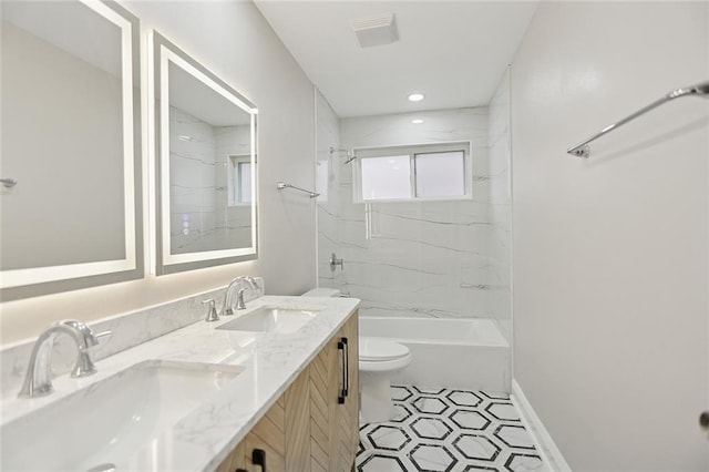 14 Derbes Dr, Gretna, LA 70053 - bathroom with double vanity, a combined bath / shower with marble appearance, and tile patterned floors
