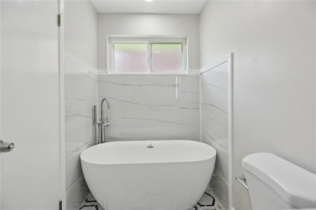 14 Derbes Dr, Gretna, LA 70053 - bathroom featuring a soaking tub and tile walls