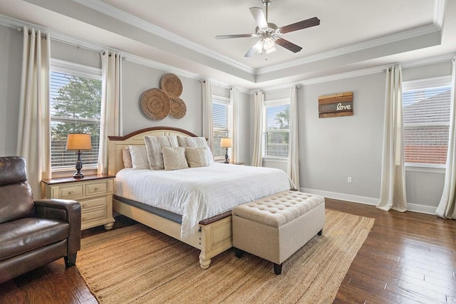 645 Pine Grove Loop, Madisonville, LA 70447 - bedroom featuring multiple windows, a raised ceiling, wood-type flooring, ornamental molding, and ceiling fan