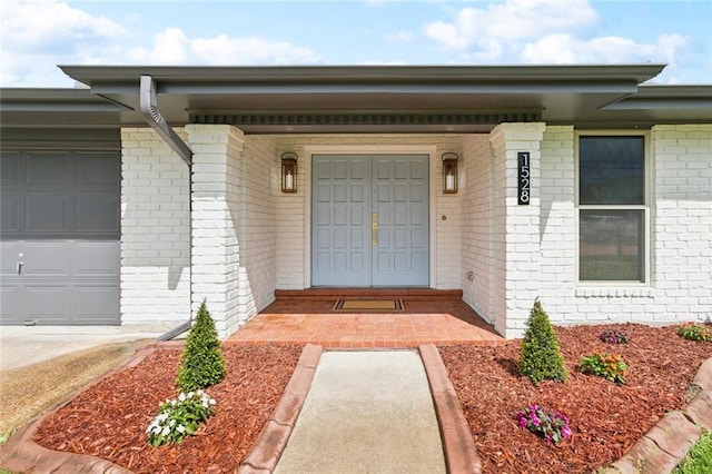 1528 N Cumberland St, Metairie, LA 70003 - property entrance with brick siding and an attached garage