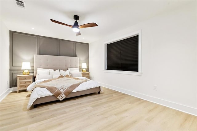 1528 N Cumberland St, Metairie, LA 70003 - bedroom with light wood-type flooring, a decorative wall, and ceiling fan