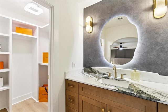 1528 N Cumberland St, Metairie, LA 70003 - bathroom featuring ceiling fan, wood finished floors, and vanity