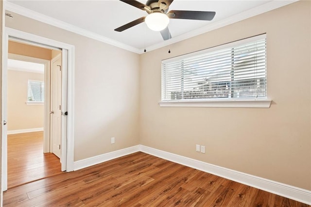 4700 Jasper St, Metairie, LA 70006 - empty room with plenty of natural light, wood finished floors, ornamental molding, and a ceiling fan