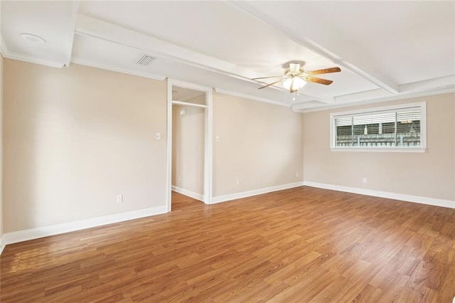 4700 Jasper St, Metairie, LA 70006 - empty room with a ceiling fan, light wood finished floors, beamed ceiling, and ornamental molding