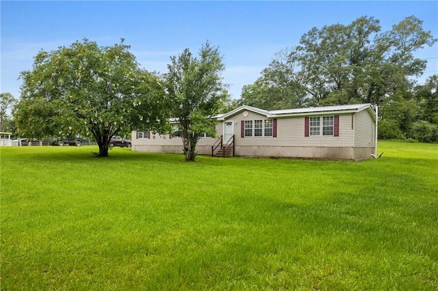 24483 Riley Rd, Pride, LA 70770 - view of front of home with a front lawn and entry steps