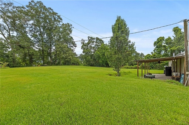 24483 Riley Rd, Pride, LA 70770 - view of green lawn with a ceiling fan