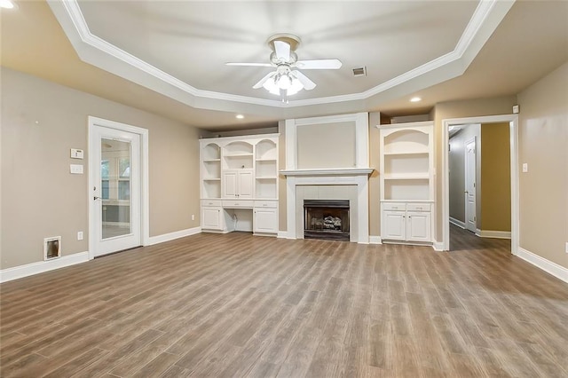 1410 Pecan St, Hammond, LA 70401 - unfurnished living room with a tray ceiling, ornamental molding, ceiling fan, wood finished floors, and recessed lighting