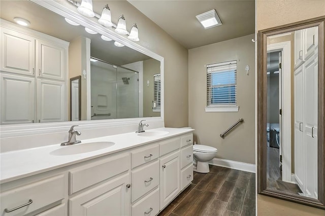 1410 Pecan St, Hammond, LA 70401 - full bath with a stall shower, double vanity, and wood finished floors