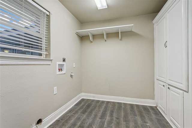 1410 Pecan St, Hammond, LA 70401 - washroom with cabinet space, hookup for an electric dryer, dark wood-type flooring, washer hookup, and hookup for a gas dryer