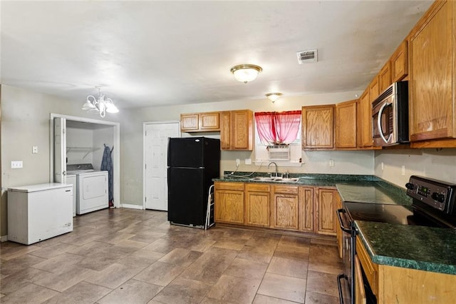 62273 N 12th St, Slidell, LA 70460 - kitchen with electric range, stainless steel microwave, freestanding refrigerator, refrigerator, and separate washer and dryer