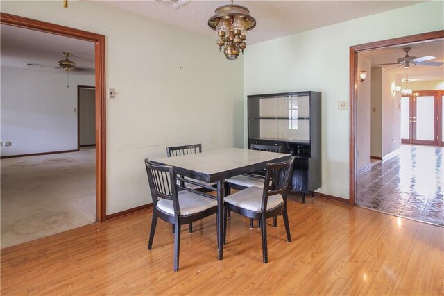 4808 Janice Ave, Kenner, LA 70065 - dining area with a chandelier, a ceiling fan, and light wood-style floors