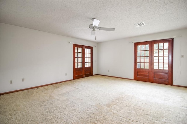 4808 Janice Ave, Kenner, LA 70065 - empty room with french doors, ceiling fan, light colored carpet, and a textured ceiling