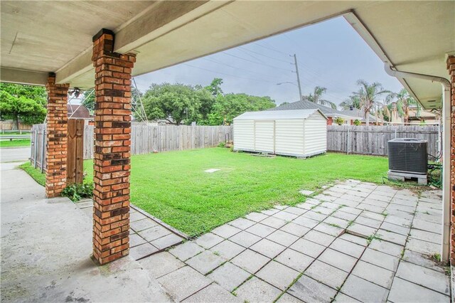 4808 Janice Ave, Kenner, LA 70065 - fenced backyard with a storage shed and a patio
