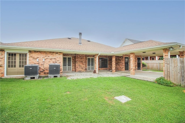 4808 Janice Ave, Kenner, LA 70065 - back of property featuring brick siding, a patio, and a shingled roof