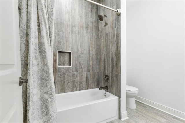 624 Wagner St, New Orleans, LA 70114 - bathroom featuring shower / tub combo with curtain and wood finished floors
