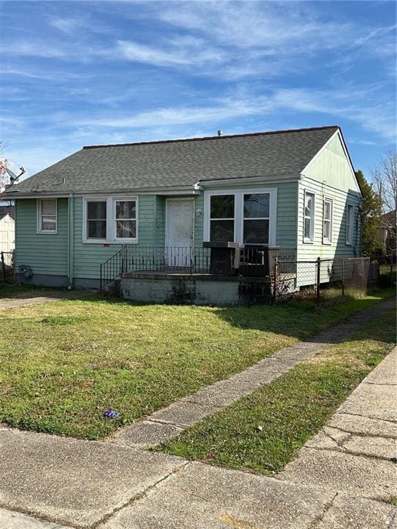 5423 Mandeville St, New Orleans, LA 70122 - view of front facade featuring roof with shingles and covered porch