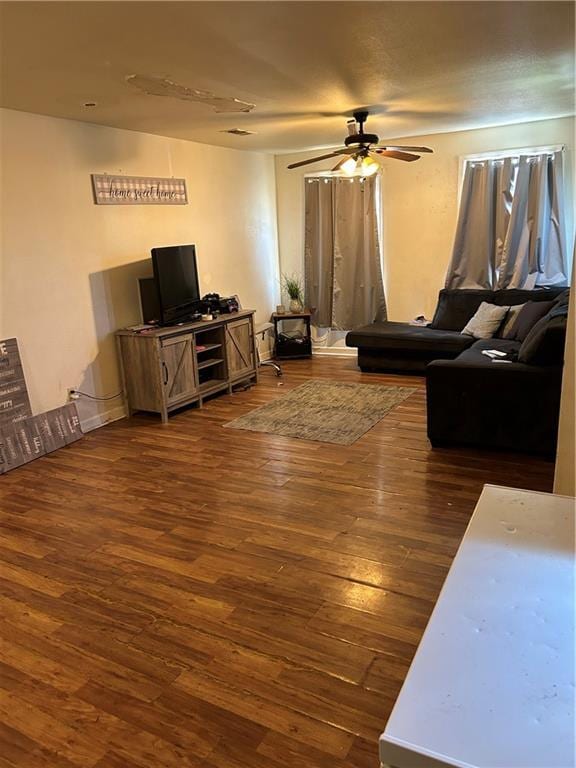 5423 Mandeville St, New Orleans, LA 70122 - living room featuring ceiling fan and dark wood-type flooring