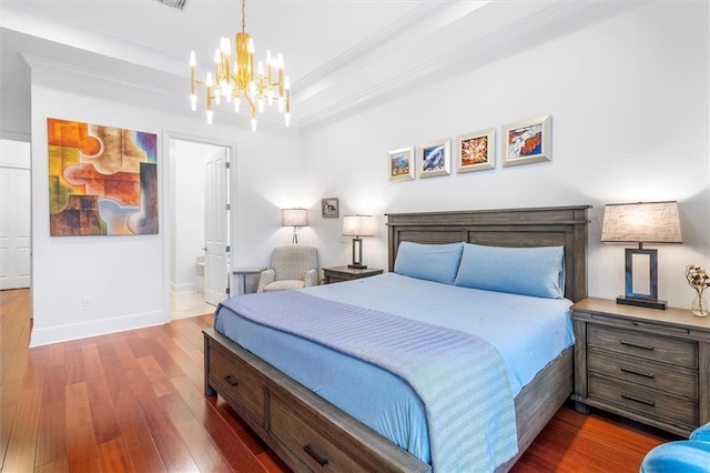 10 Finch St, New Orleans, LA 70124 - bedroom featuring a chandelier, dark wood finished floors, ornamental molding, and ensuite bath