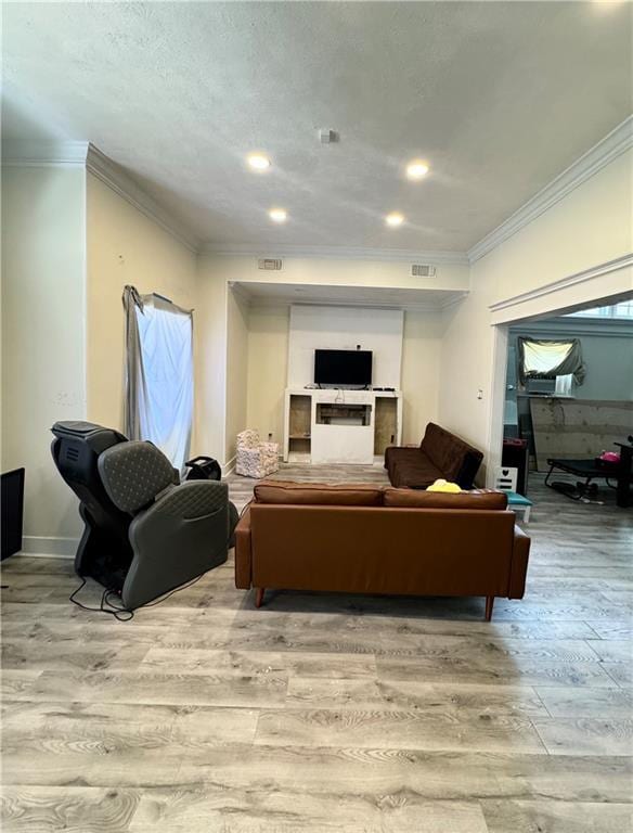 4925 Jasper St, Metairie, LA 70006 - living room with light wood-style floors, crown molding, and recessed lighting