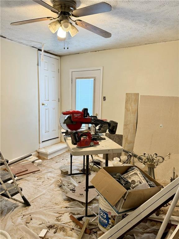 4925 Jasper St, Metairie, LA 70006 - dining room featuring a textured ceiling and a ceiling fan