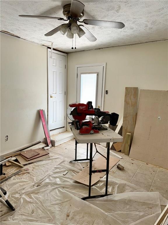 4925 Jasper St, Metairie, LA 70006 - dining space with a ceiling fan and a textured ceiling