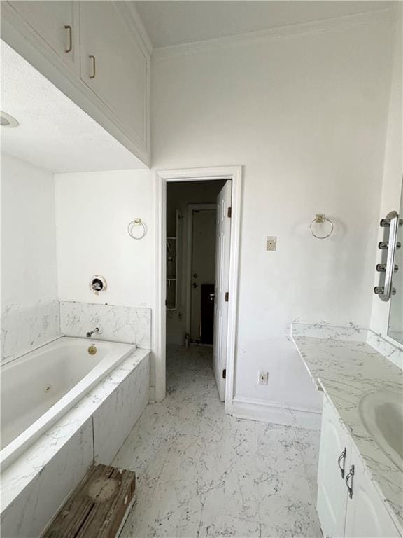 4925 Jasper St, Metairie, LA 70006 - bathroom featuring a garden tub, vanity, and crown molding