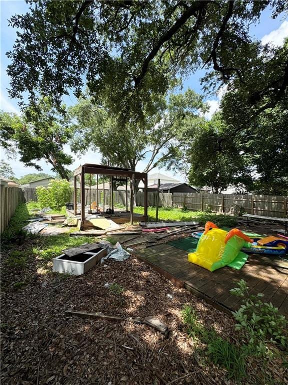 4925 Jasper St, Metairie, LA 70006 - view of jungle gym with a fenced backyard and a deck