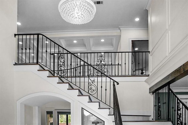 31350 Walker Rd, Walker, LA 70785 - staircase featuring a chandelier, ornamental molding, recessed lighting, a towering ceiling, and arched walkways