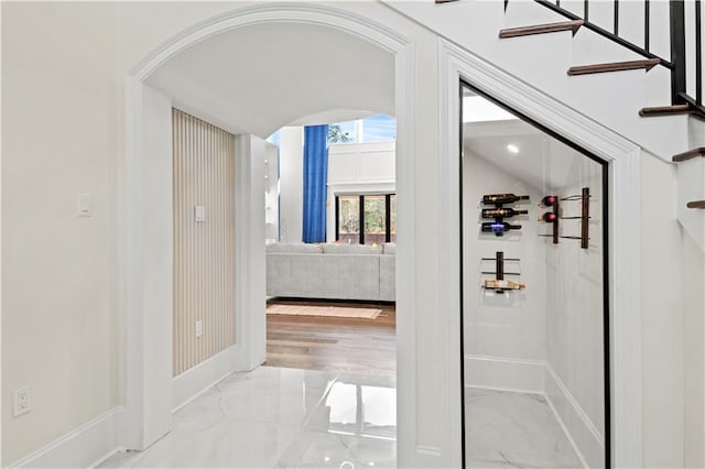 31350 Walker Rd, Walker, LA 70785 - corridor with light marble finish floors and arched walkways