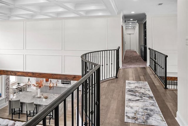 31350 Walker Rd, Walker, LA 70785 - corridor with a decorative wall, wood finished floors, an upstairs landing, beamed ceiling, and recessed lighting