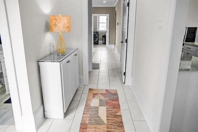 31350 Walker Rd, Walker, LA 70785 - hall featuring crown molding and separate washer and dryer