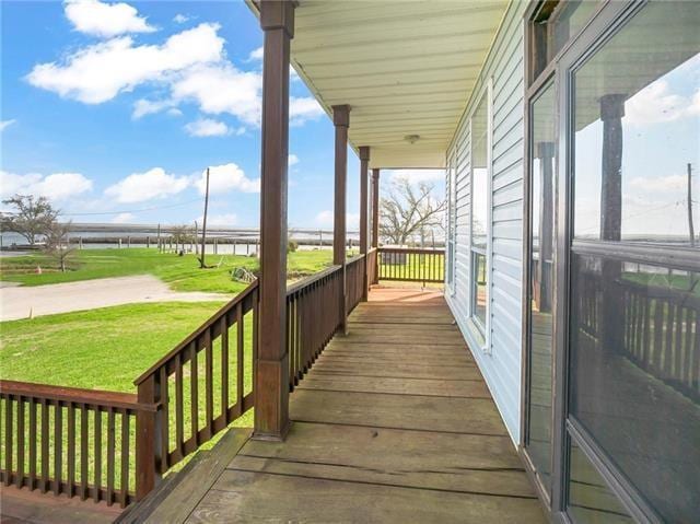 30 Clinton Dr, New Orleans, LA 70129 - wooden porch with a yard